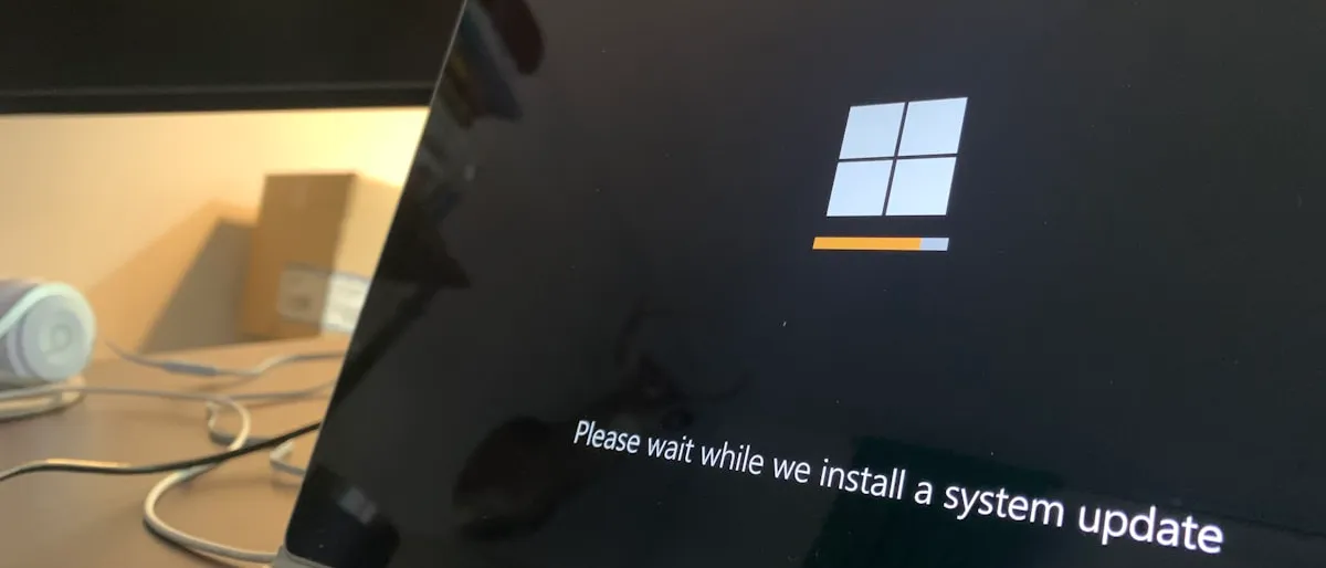 A laptop screen showing a Windows system update in progress