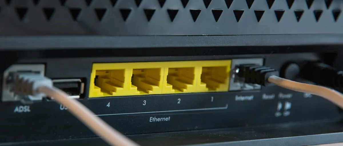 Close-up of ethernet cables plugged into the back of a network router