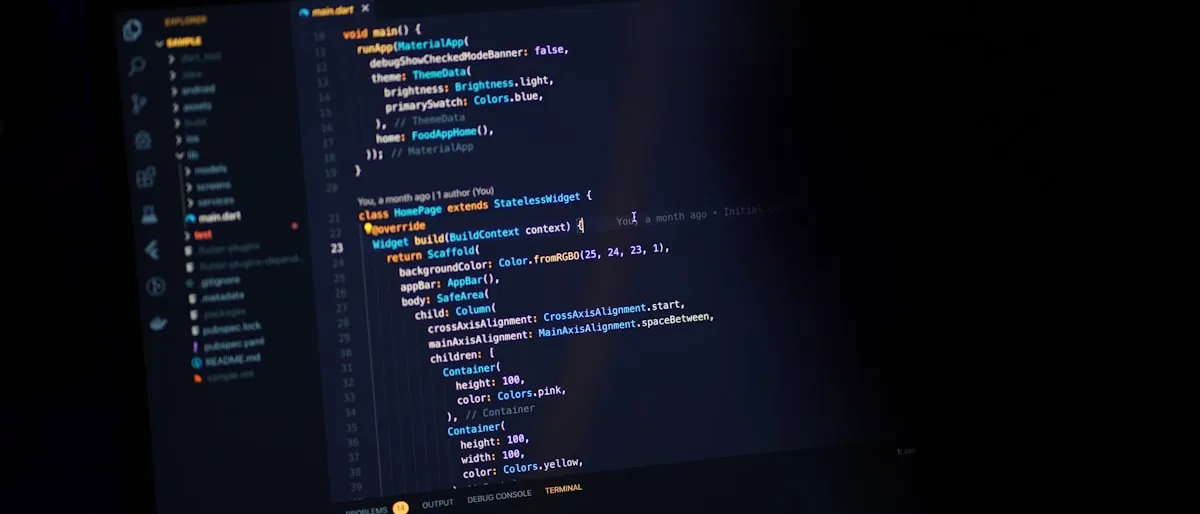 Close-up of a dark computer monitor displaying lines of code