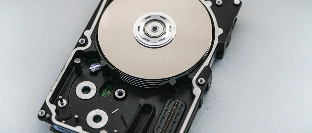 Close-up of an open computer hard disk drive showing the internal platter