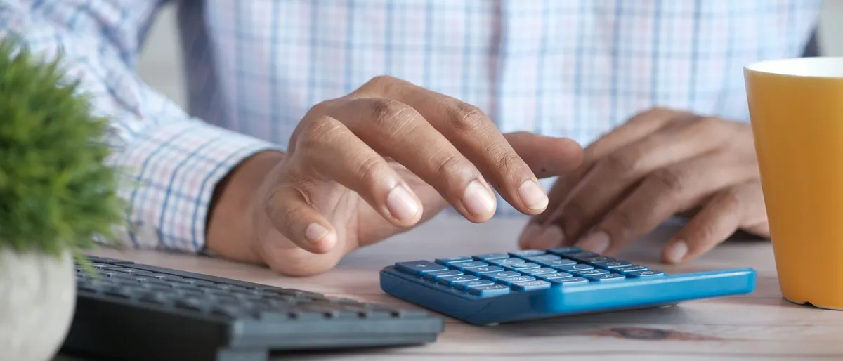A credit card resting on top of a monthly billing statement